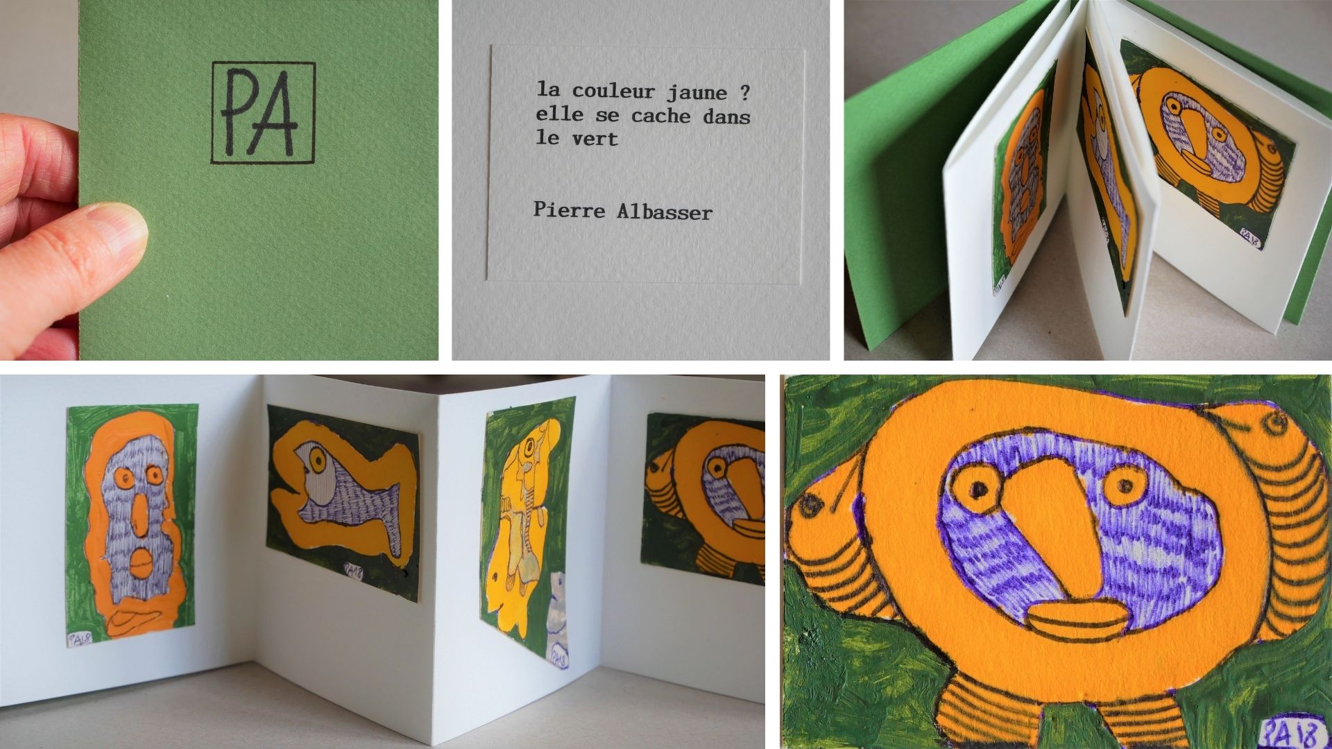 livre miniature avec une couverture verte et initiales P.A.