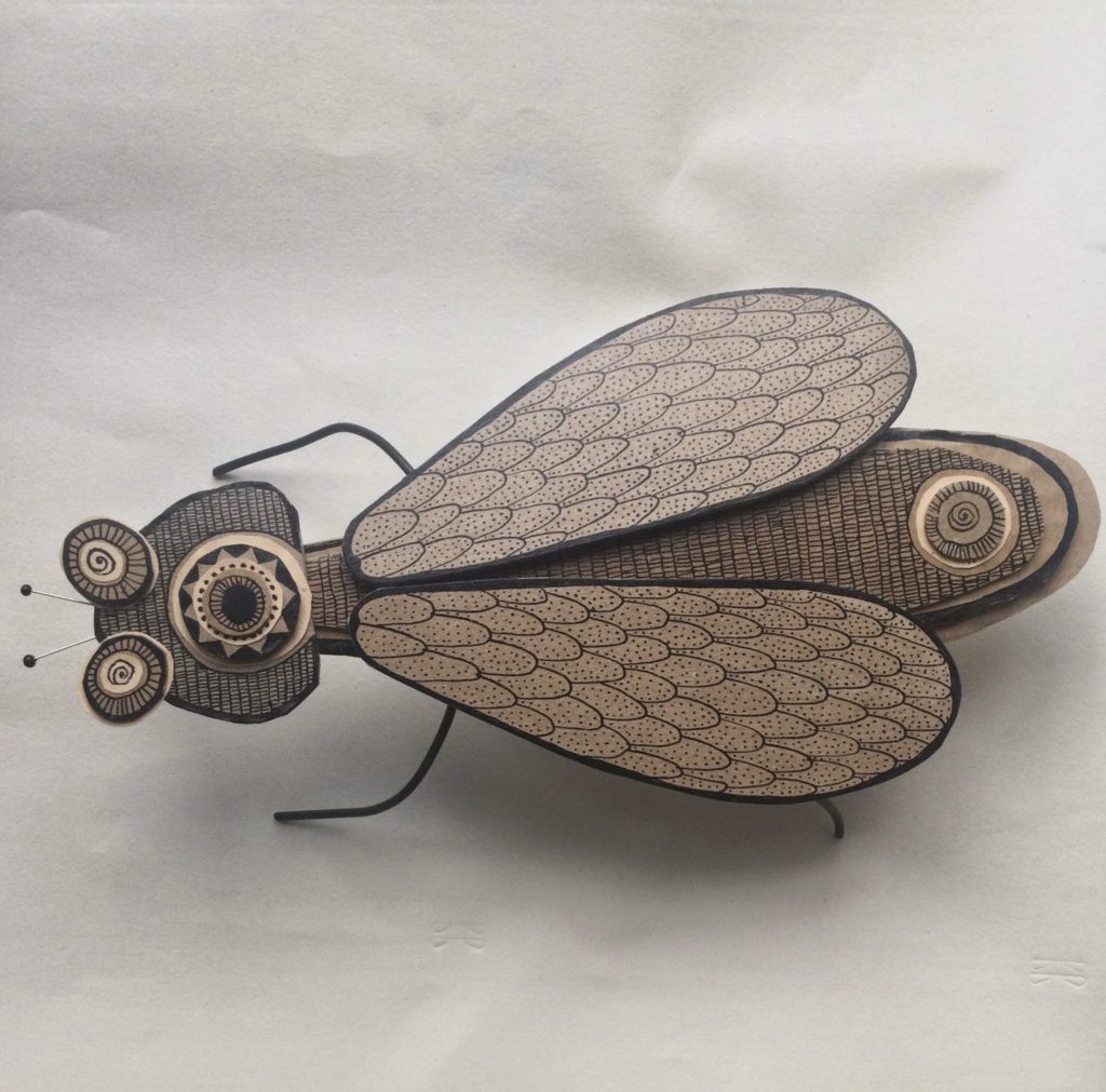 image d'une réalisation en volume en caton représentant un insecte